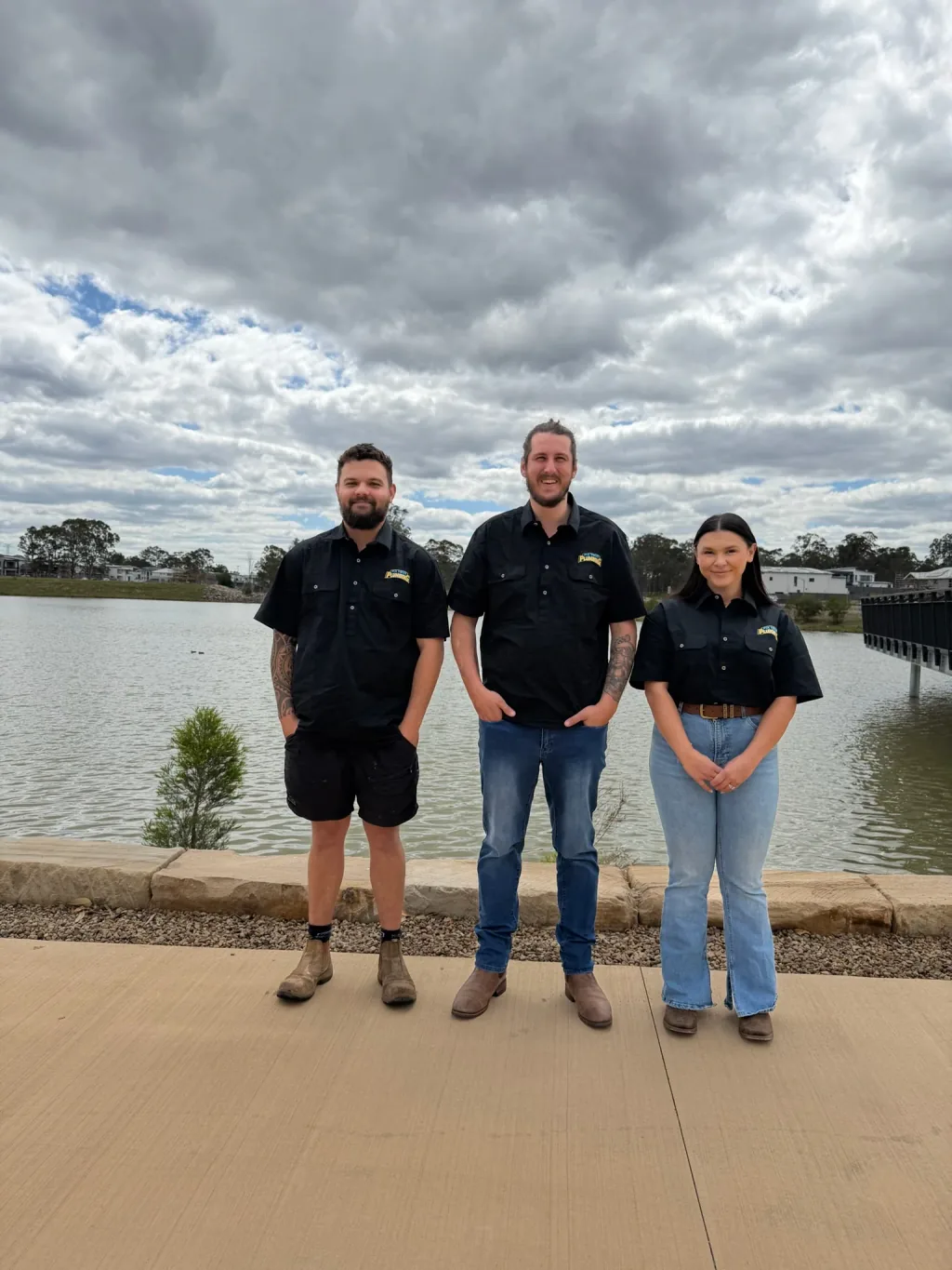 The Fix Your Plumbing team in uniform by the Sydney waterfront