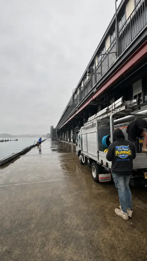 Fix Your Plumbing crew and branded truck on a Sydney waterfront job